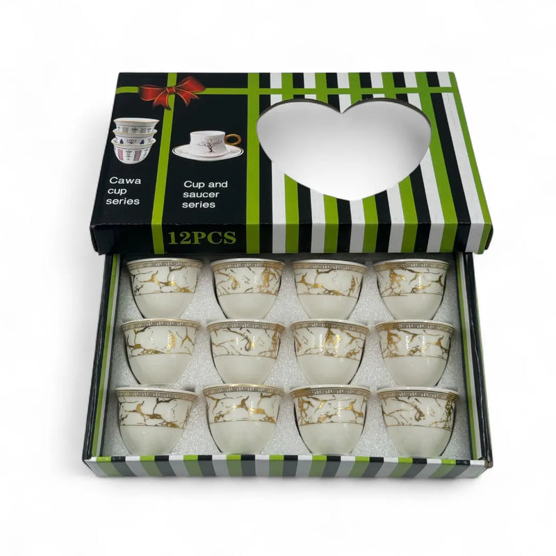 Traditional Lebanese coffee finjans with gold geometric detailing.