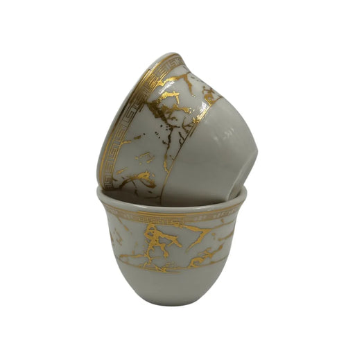 Set of 12 white and gold porcelain coffee cups on Spotngrab Lebanon.