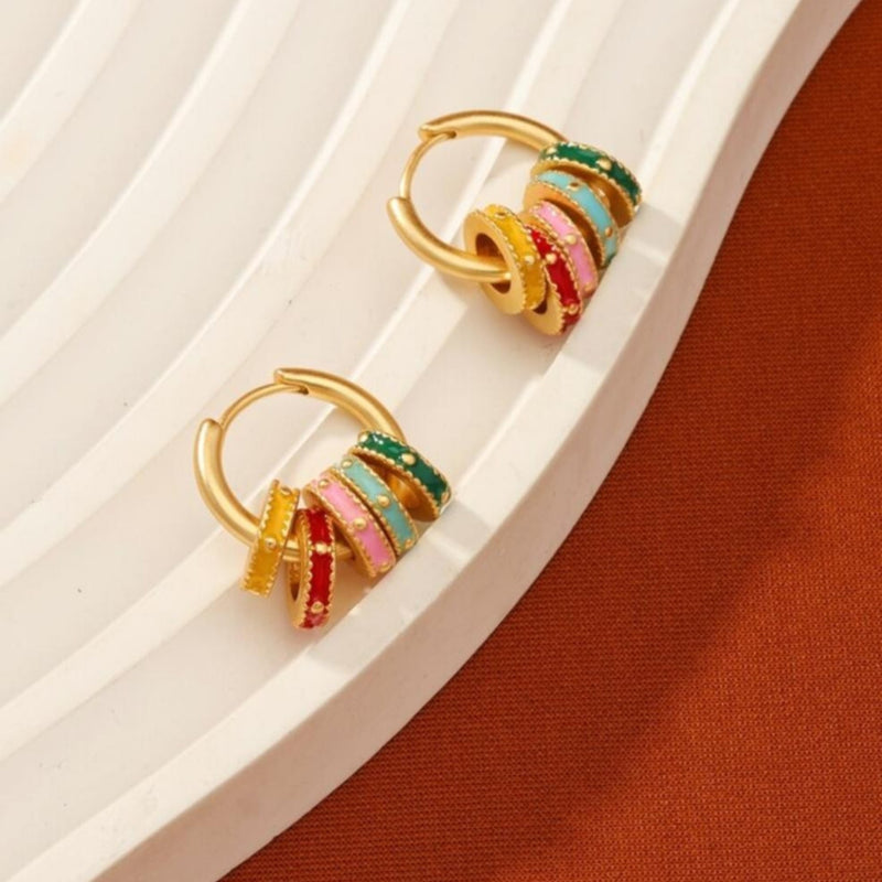 Gold hoop earrings with pastel enamel clover and geometric charm accents available at spotngrab lebanon