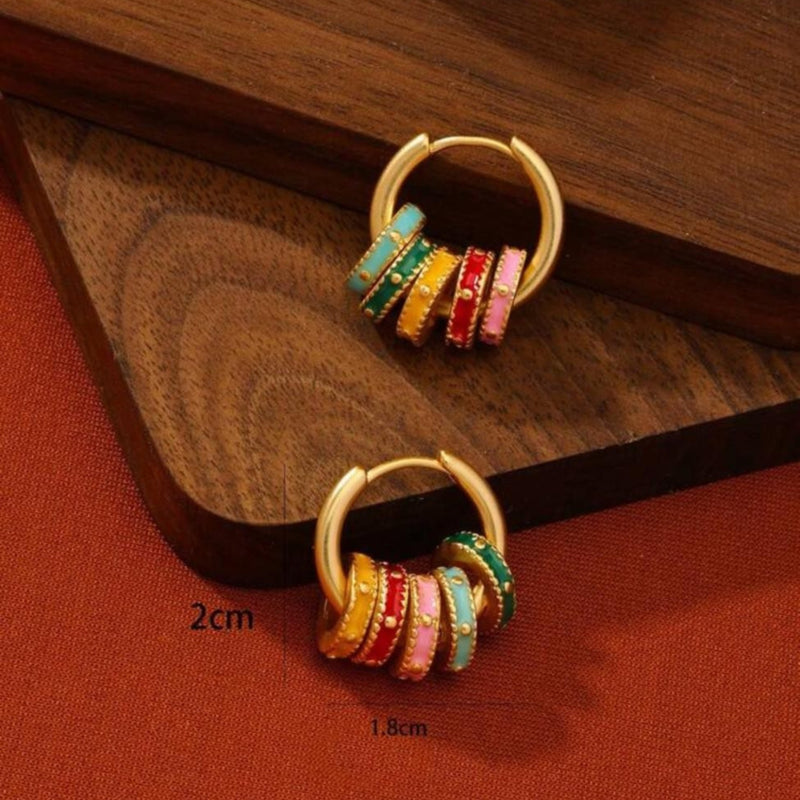 Gold hoop earrings with pastel enamel clover and geometric charm accents available at spotngrab lebanon