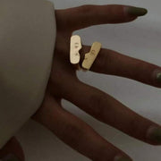 Set of two gold open cuff rings with abstract figure and heart design shop at spotngrab.com lebanon