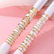 Gold stacked rings with eyelash and triangle designs