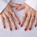 Yellow gold rings with pearl details – elegant holiday jewelry