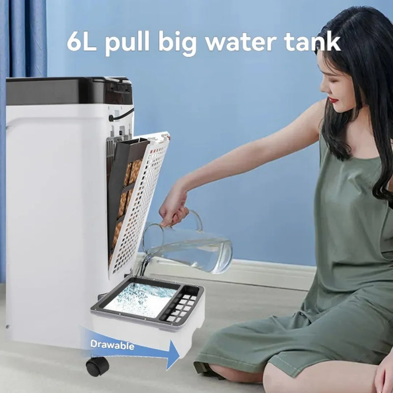 A hand sliding out the 6L removable water tank from the back of the air cooler to show easy cleaning and ice pack placement.