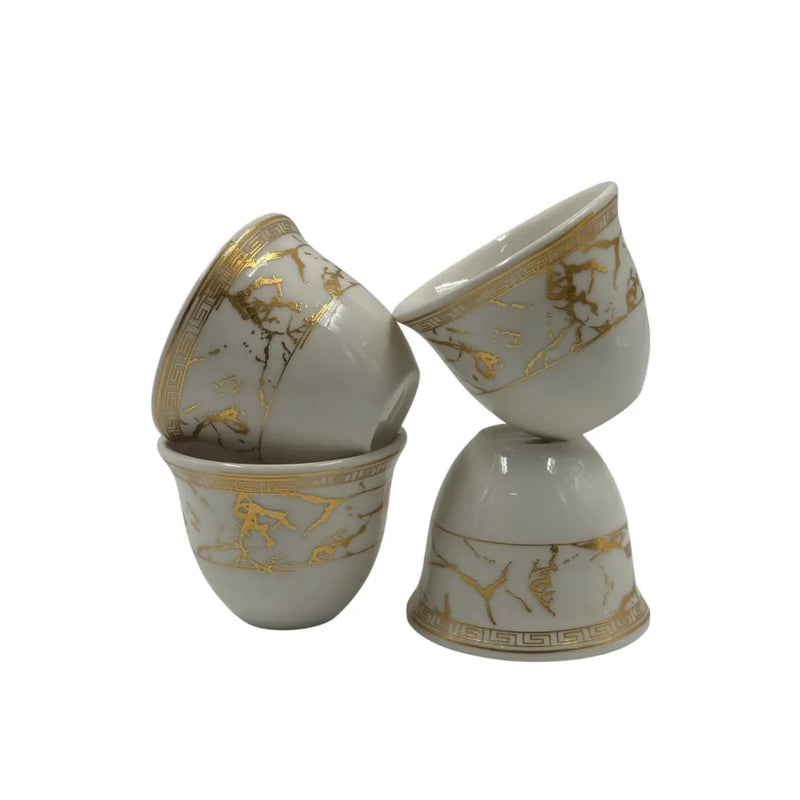 12-piece white porcelain Arabic coffee cups with gold Greek key pattern.