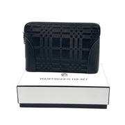 Black patterned leather biometric security clutch bag resting on a white presentation box on Spotngrab Lebanon.