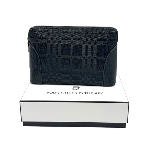 Black patterned leather biometric security clutch bag resting on a white presentation box on Spotngrab Lebanon.