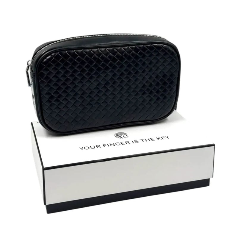 Black woven-leather smart clutch bag with a biometric fingerprint lock sitting on top of a white box on Spotngrab Lebanon.