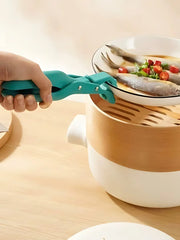 Multi-function anti-scalding clip lifting a cast iron pot lid - Kitchen accessories available at SpotNGrab