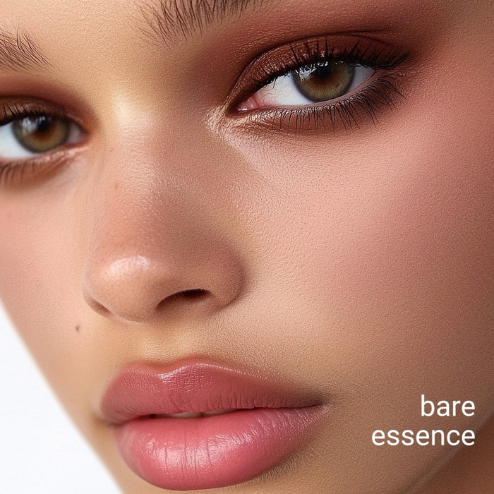 Close-up of a woman's face with 'bare essence'