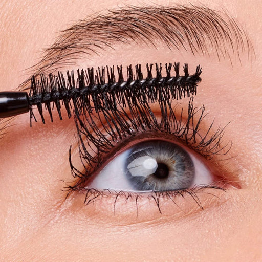Close-up of an eye with mascara being applied