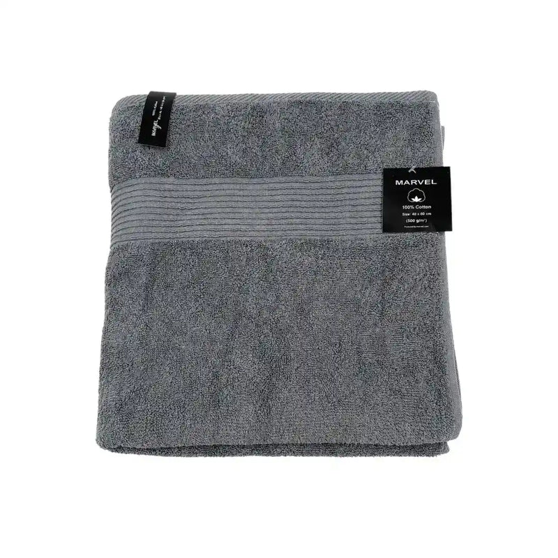 Marvel 100% cotton bath towels folded in dark grey, light grey, and pink on Spotngrab Lebanon.