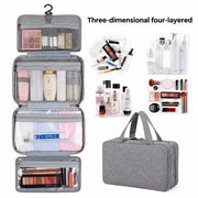 Grey four-layered hanging travel toiletry and cosmetic organizer bag shown open and hung on Spotngrab Lebanon.