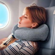 A traveler resting comfortably on an airplane seat using the Hoco HX70 memory foam neck pillow available at Spotngrab Lebanon.