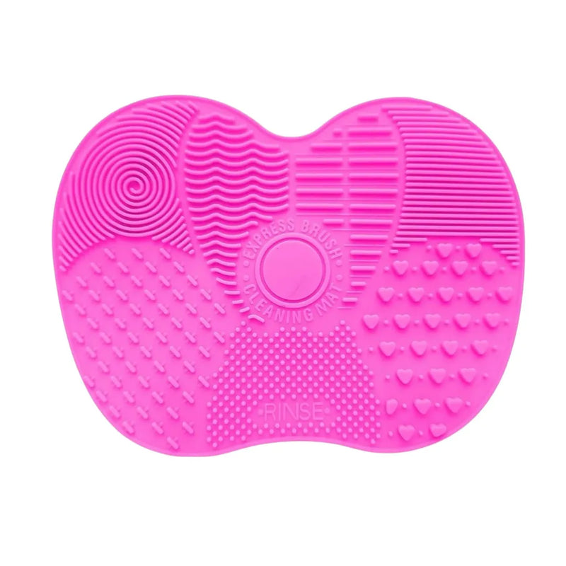 Close-up of different textures on a pink silicone brush cleaner pad.