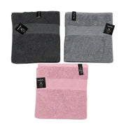 Marvel 100% cotton bath towels folded in dark grey, light grey, and pink on Spotngrab Lebanon.