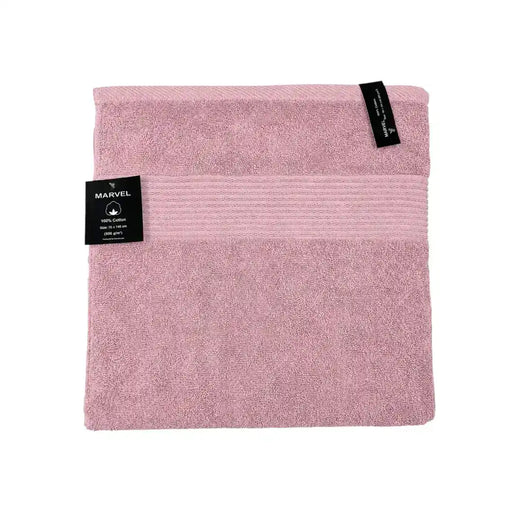 Marvel 100% cotton bath towels folded in dark grey, light grey, and pink on Spotngrab Lebanon.
