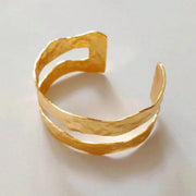 Minimalist gold open bangle bracelet with multi-element accents for daily casual wear Availabel at spotngrab lebanon