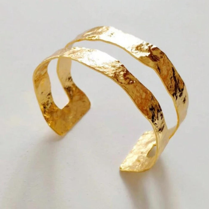 Minimalist gold open bangle bracelet with multi-element accents for daily casual wear Availabel at spotngrab lebanon