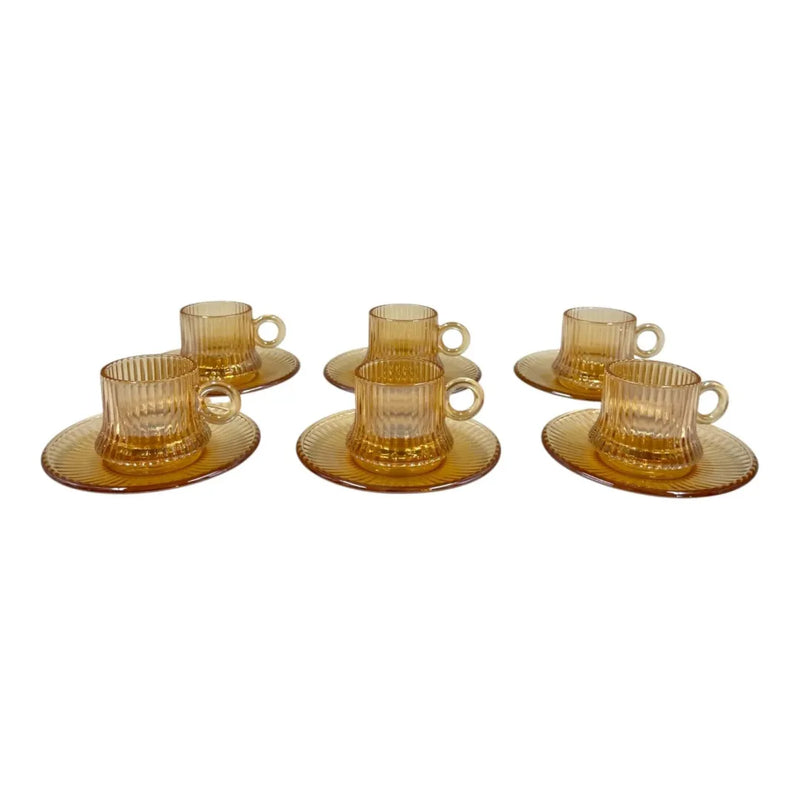 Mini amber glass pocillo cup measuring 5x6cm with a distinct vertical ribbed pattern sitting centered on its matching amber glass saucer on Spotngrab Lebanon.