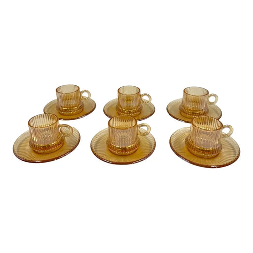 Mini amber glass pocillo cup measuring 5x6cm with a distinct vertical ribbed pattern sitting centered on its matching amber glass saucer on Spotngrab Lebanon.