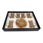 A complete 12-piece in a box amber glass tea service set showing six 100ml vertical ribbed cups with handles sitting on their matching fluted saucers on Spotngrab Lebanon.