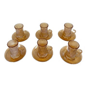 A complete 12-piece amber glass tea service set showing six 100ml vertical ribbed cups with handles sitting on their matching fluted saucers on Spotngrab Lebanon.