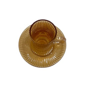 A complete 1 piece amber glass tea service set showing 100ml vertical ribbed cups with handles sitting on their matching fluted saucers on Spotngrab Lebanon.