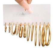 Set of 6 pairs of gold-toned fashion hoop earrings with faux pearls.