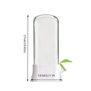 Vertical clear herb saver container storing fresh mint and cilantro inside a fridge door shelf.