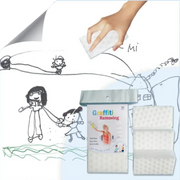 Magic sponge removing kids drawings and graffiti from wall