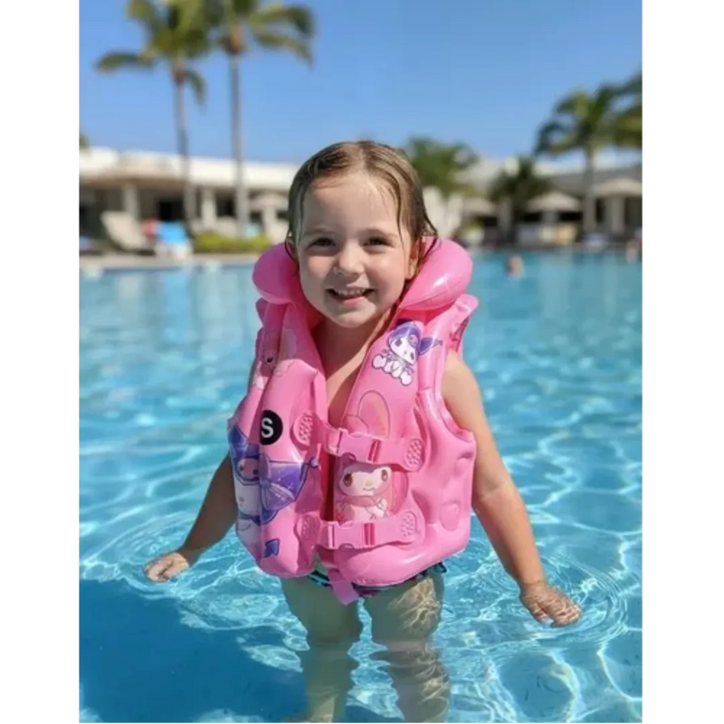 Young toddler safely floating in a swimming pool wearing a pink adjustable Sanrio character life jacket from spotngrab lebanon