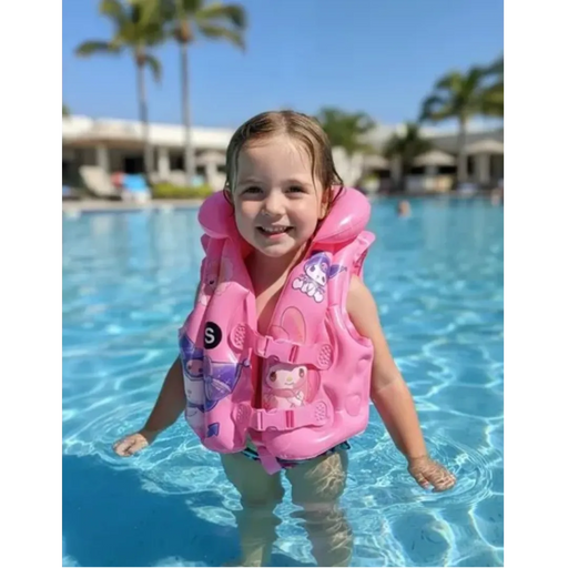 Young toddler safely floating in a swimming pool wearing a pink adjustable Sanrio character life jacket from spotngrab lebanon