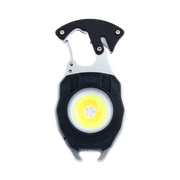 Multi-purpose rechargeable LED emergency keychain light displaying the bright flood beam and integrated tool attachments on Spotngrab Lebanon