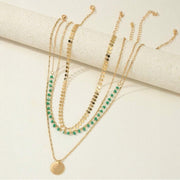 Layered gold-tone bohemian necklace set with turquoise pendants – 4 pieces available at spotngrab lebanon