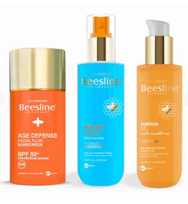 Woman using Beesline Summer Ready Kit at the beach for tanning and sun protection