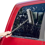 Cleaning a car windshield with a professional squeegee sponge at a gas station – automotive care products Lebanon.