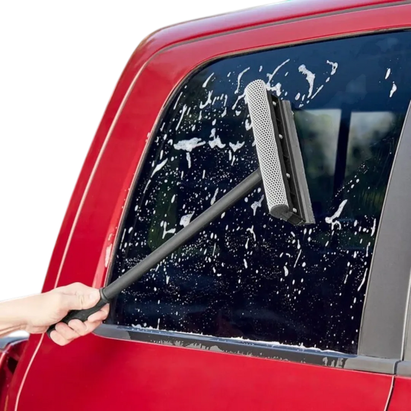 Cleaning a car windshield with a professional squeegee sponge at a gas station – automotive care products Lebanon.